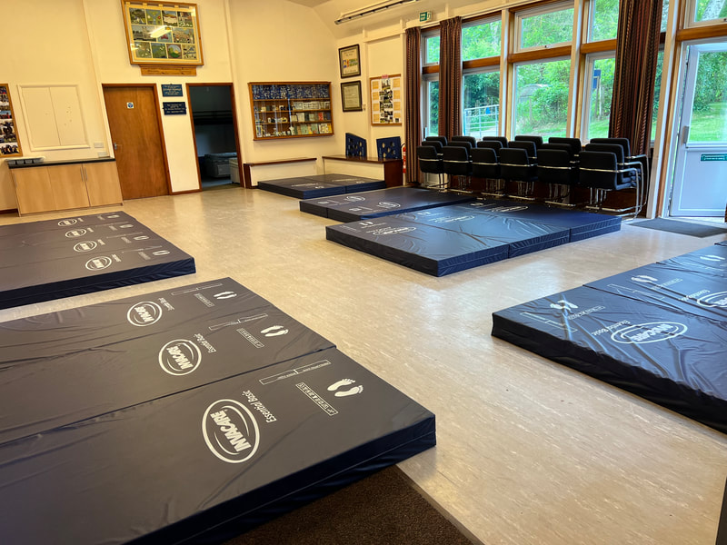 Assembly hall accommodation - A photo of the hall with the mattresses laid out for a sleepover